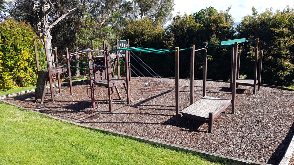 The playground with swings, climbing frame and monkey bars