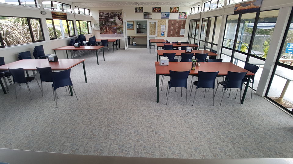 The dining hall set with tables and chairs